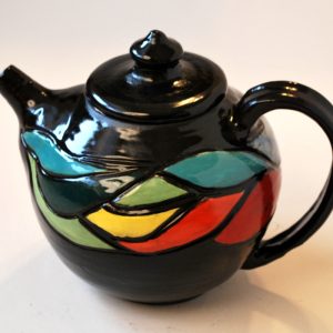 Carved and Painted Teapot with Black Background.2