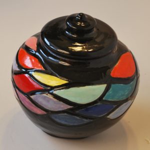 Carved and Painted Jar with Black Background