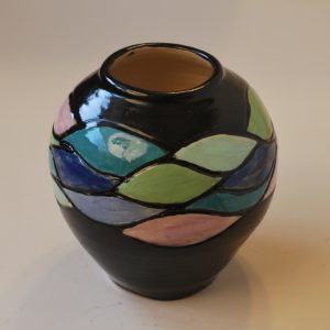 Carved and Painted Round Vase with Black Background