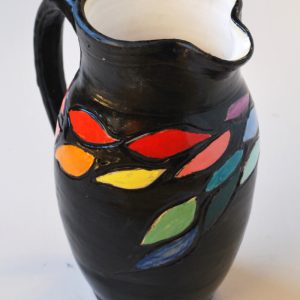 Carved and Painted Pitcher with Black Background
