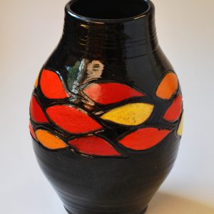 Carved and Painted Vase with Black Background